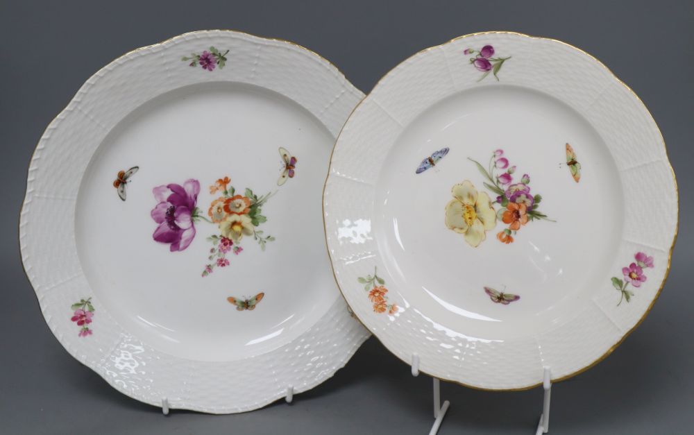 A set of eight Berlin plates, decorated with butterflies and flowers, diameter 21cm (5) and 24cm (3)
